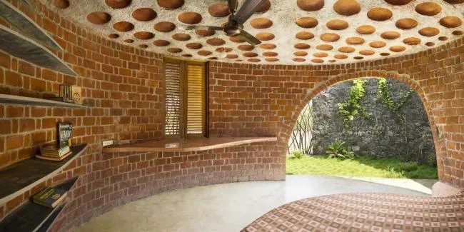 BIM Architecture | Flying Curves Reflected in the Village Skyline: Indian Red Brick House/iStudio Architecture