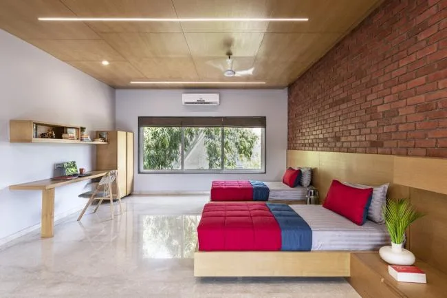 BIM Architecture | Passionate like fire, introverted like a plow ox: India's 'Red Box' Home/The Grid Architects