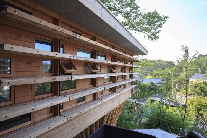BIM architecture | V-shaped wooden houses embedded in terrain/ADX