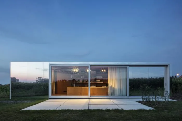 BIM Architecture | Glass Box Reflecting Green Grass and Blue Sky/TOOP