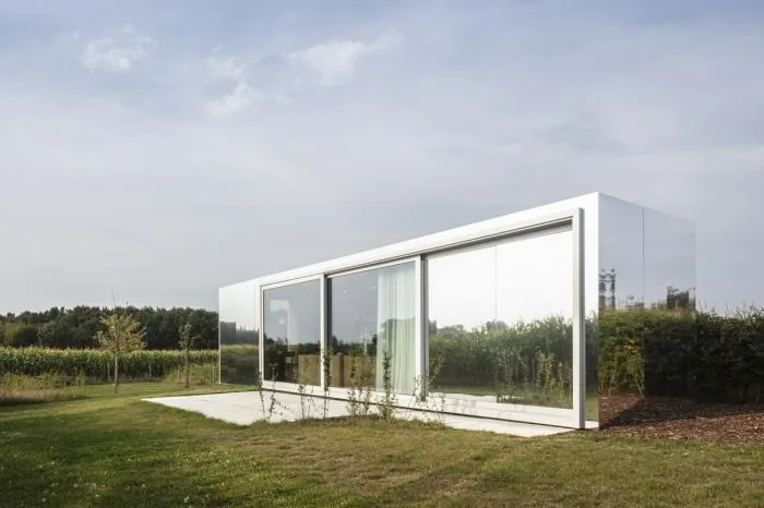 BIM Architecture | Glass Box Reflecting Green Grass and Blue Sky/TOOP
