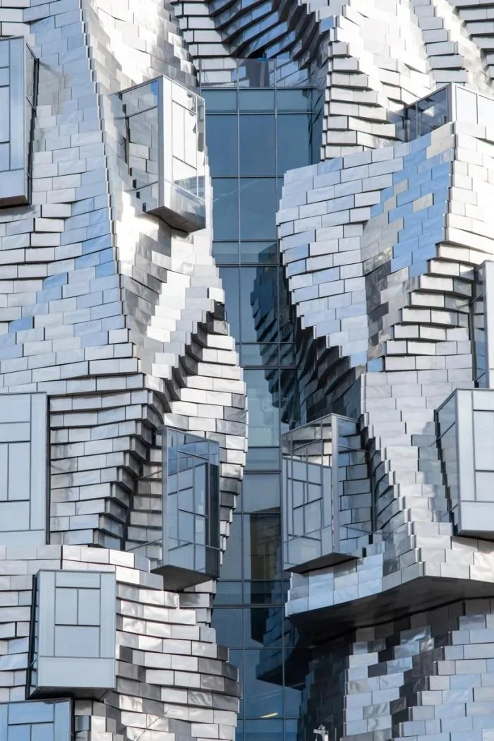 BIM Architecture | Frank Gehry's LUMA Building is nearing completion, featuring dynamic sculptures covered in silver aluminum panels