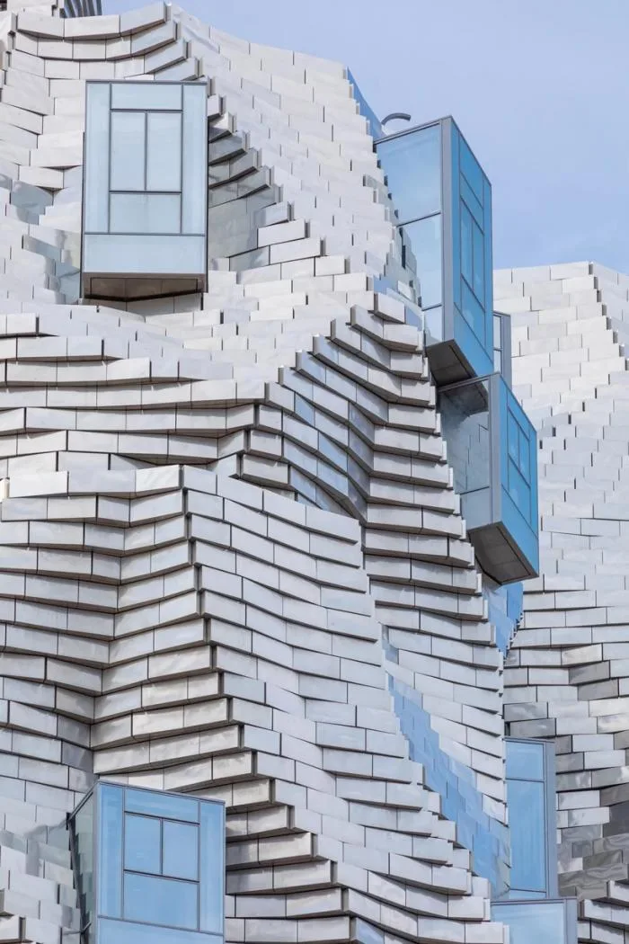 BIM Architecture | Frank Gehry's LUMA Building is nearing completion, featuring dynamic sculptures covered in silver aluminum panels