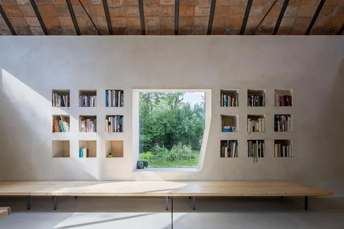 BIM architecture | Zen inspired cottage under exposed brick ceiling