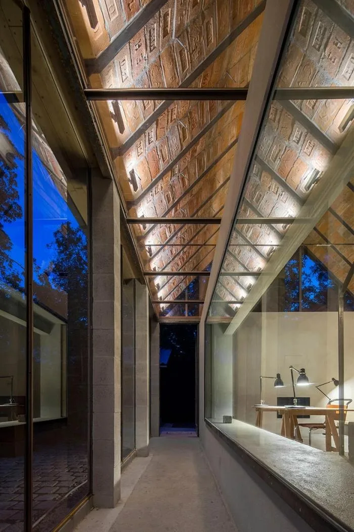BIM architecture | Zen inspired cottage under exposed brick ceiling