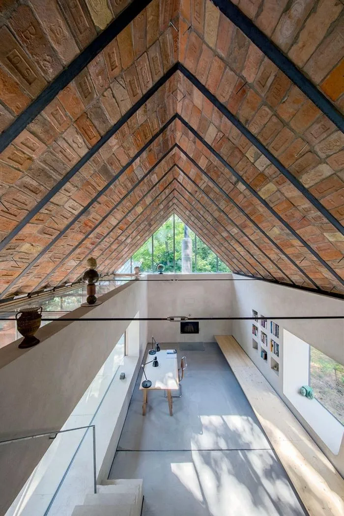 BIM architecture | Zen inspired cottage under exposed brick ceiling