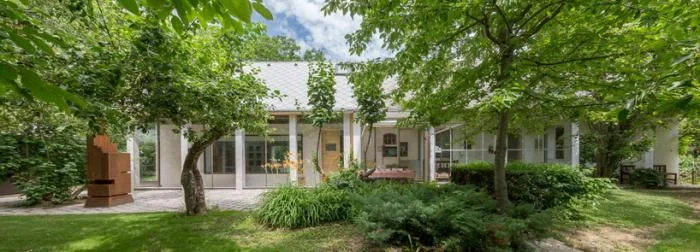 BIM architecture | Zen inspired cottage under exposed brick ceiling