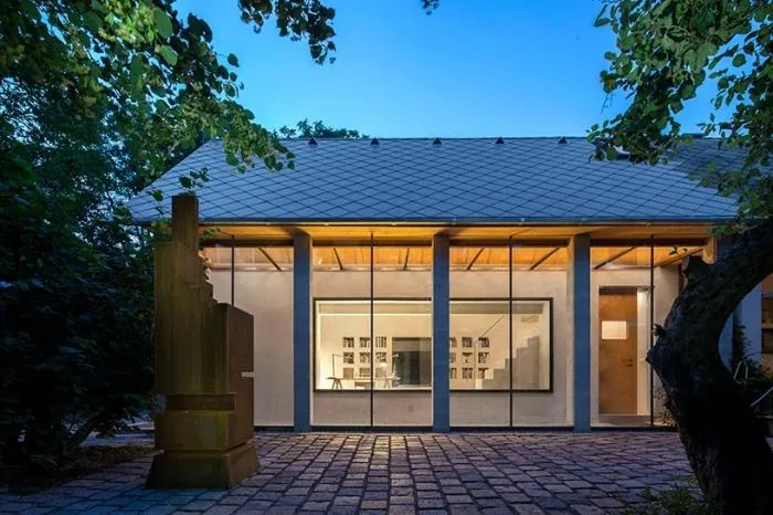 BIM architecture | Zen inspired cottage under exposed brick ceiling