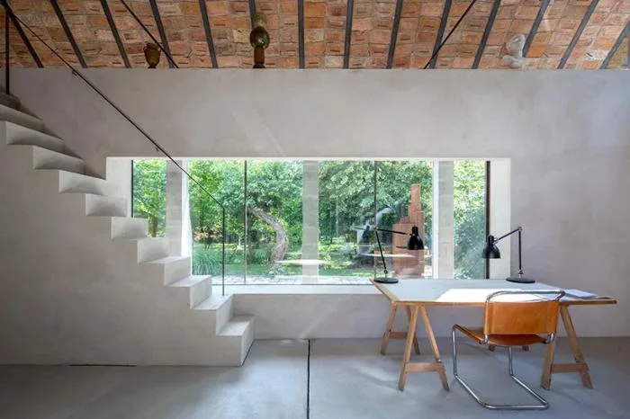 BIM architecture | Zen inspired cottage under exposed brick ceiling