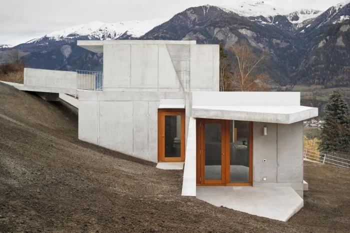 BIM Architecture | A Folding and Versatile Concrete Hut Surrounded by Mountains