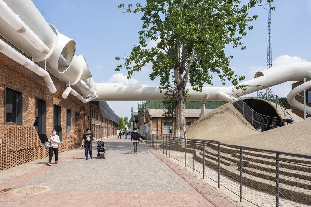 BIM Architecture | Hilltop and Pipe Slide: The Playscape Children's Growth Center/Unaware Architecture