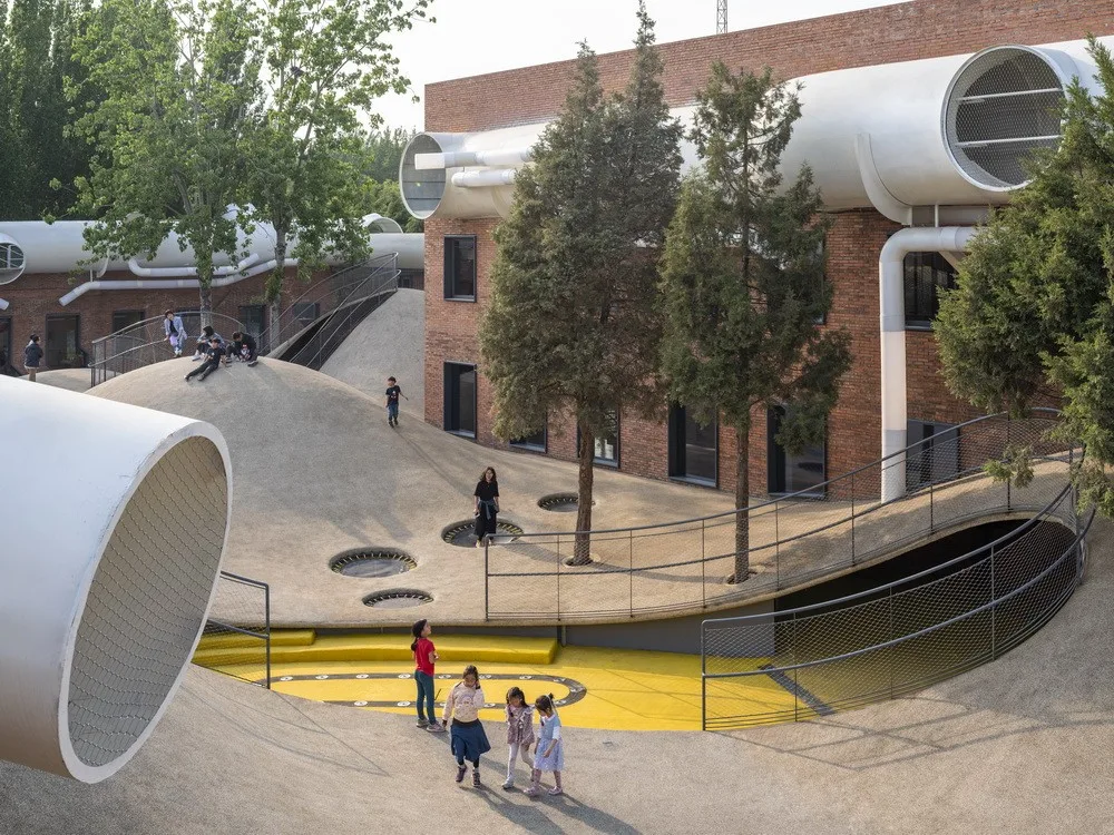 BIM Architecture | Hilltop and Pipe Slide: The Playscape Children's Growth Center/Unaware Architecture