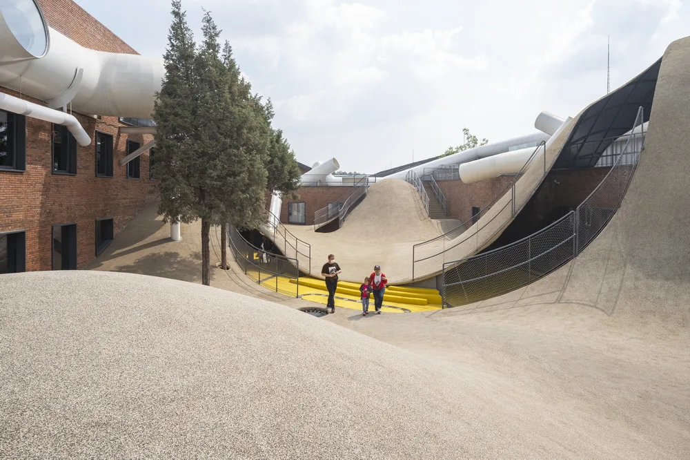 BIM Architecture | Hilltop and Pipe Slide: The Playscape Children's Growth Center/Unaware Architecture