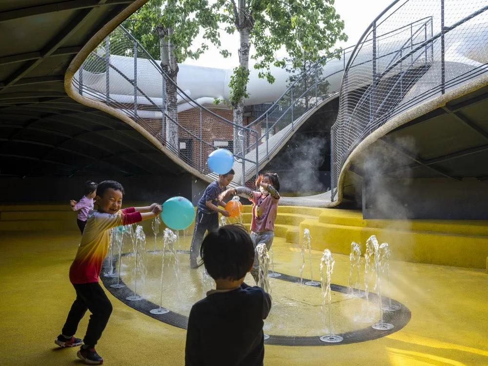 BIM Architecture | Hilltop and Pipe Slide: The Playscape Children's Growth Center/Unaware Architecture