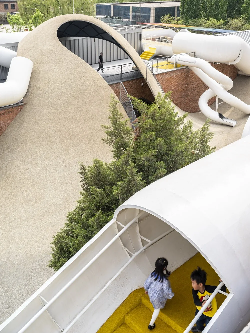 BIM Architecture | Hilltop and Pipe Slide: The Playscape Children's Growth Center/Unaware Architecture