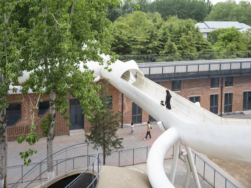 BIM Architecture | Hilltop and Pipe Slide: The Playscape Children's Growth Center/Unaware Architecture
