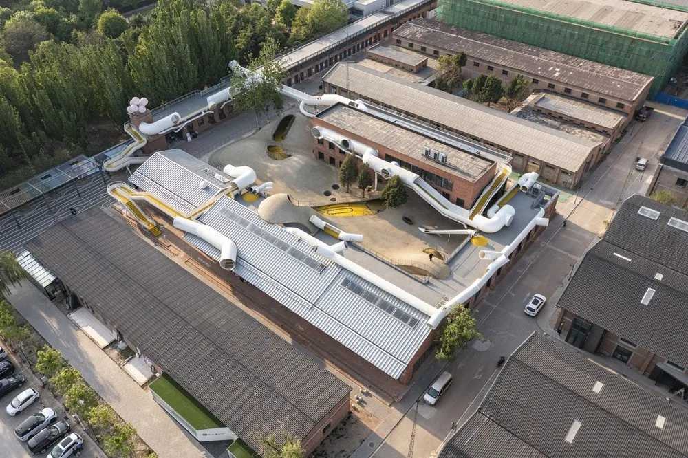 BIM Architecture | Hilltop and Pipe Slide: The Playscape Children's Growth Center/Unaware Architecture