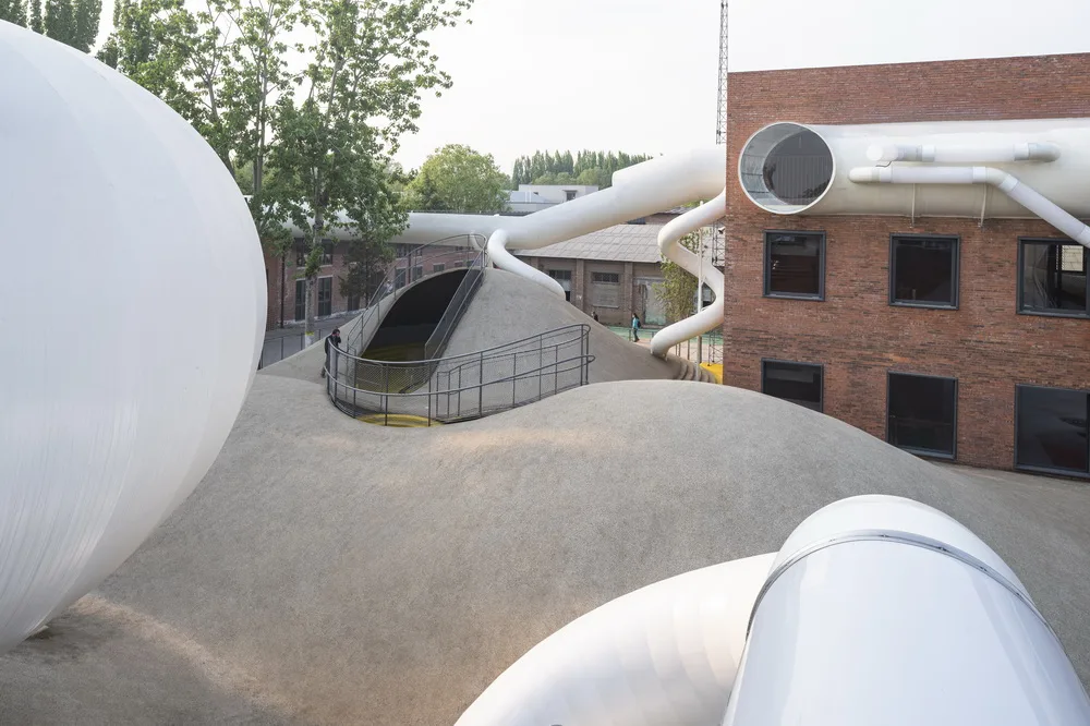 BIM Architecture | Hilltop and Pipe Slide: The Playscape Children's Growth Center/Unaware Architecture