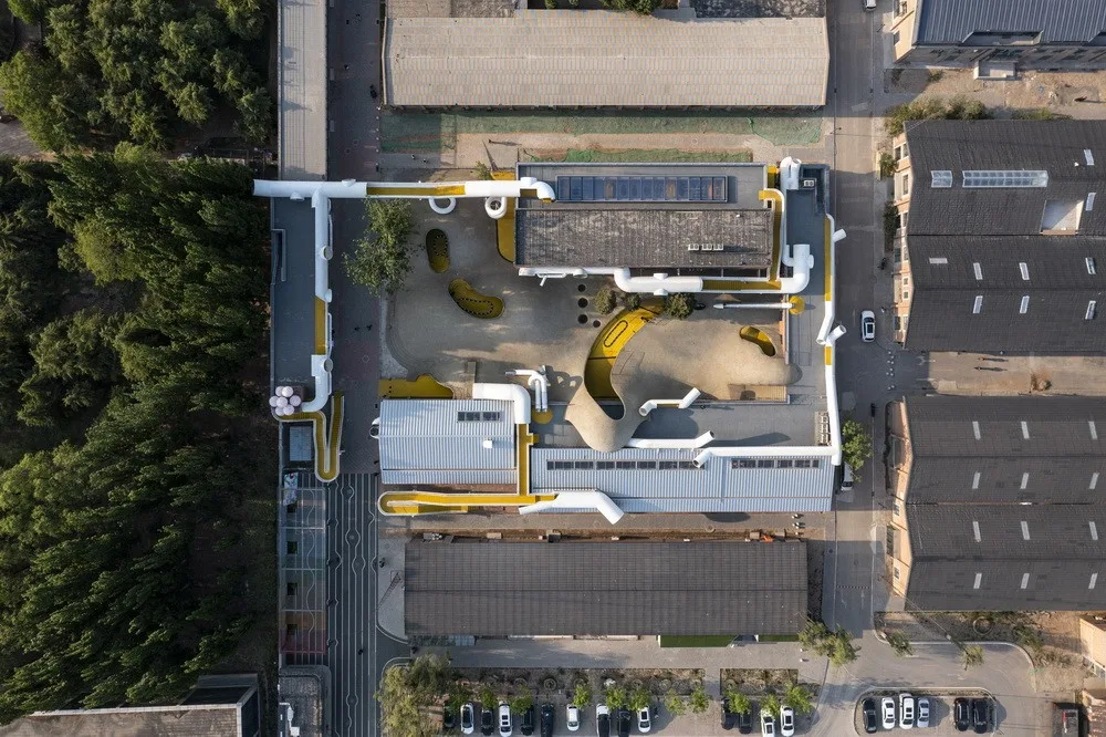 BIM Architecture | Hilltop and Pipe Slide: The Playscape Children's Growth Center/Unaware Architecture