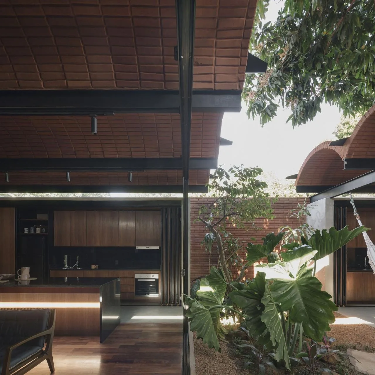 BIM Architecture | Handmade pressed brick and wood construction for self owned houses/Equipo de Arquitectura