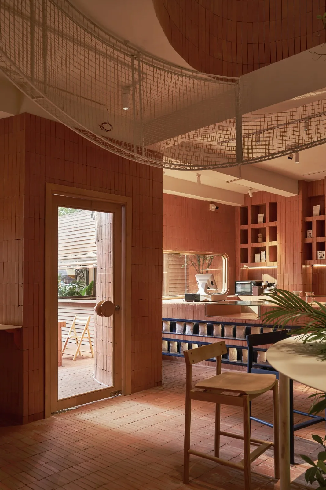 BIM Architecture | Collision of Curved Metal Grid and Red Clay Bricks: Brother Coffee Baking Shop/Red5 Studio