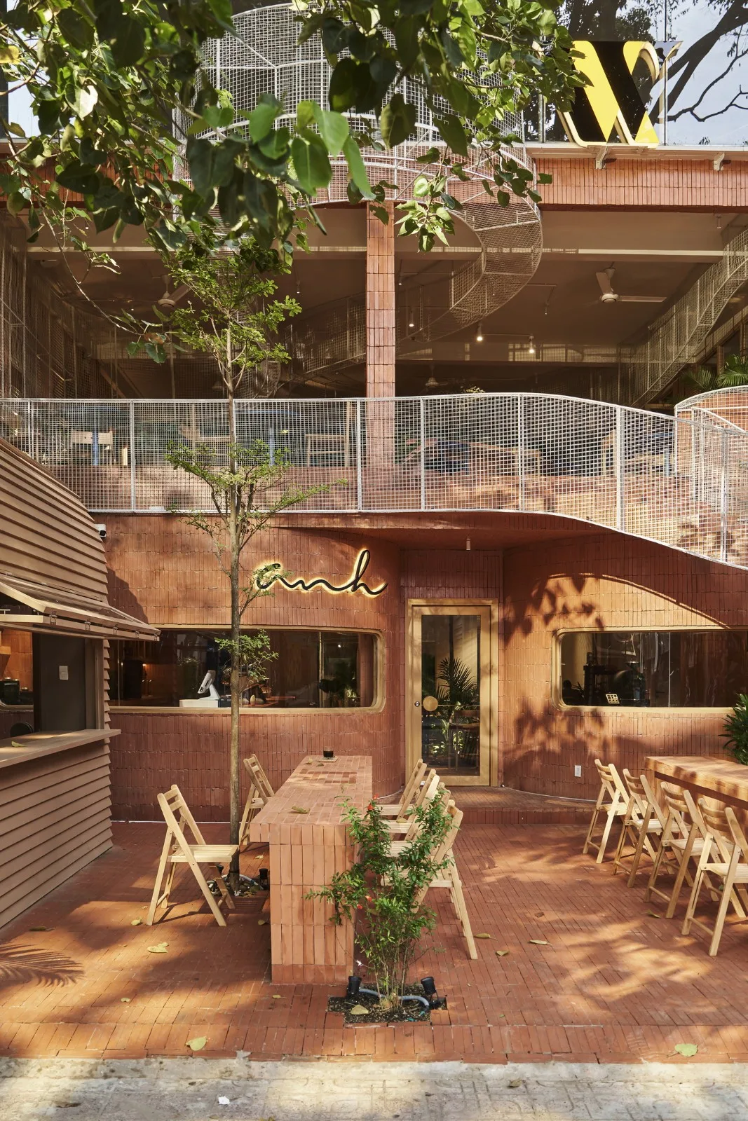 BIM Architecture | Collision of Curved Metal Grid and Red Clay Bricks: Brother Coffee Baking Shop/Red5 Studio