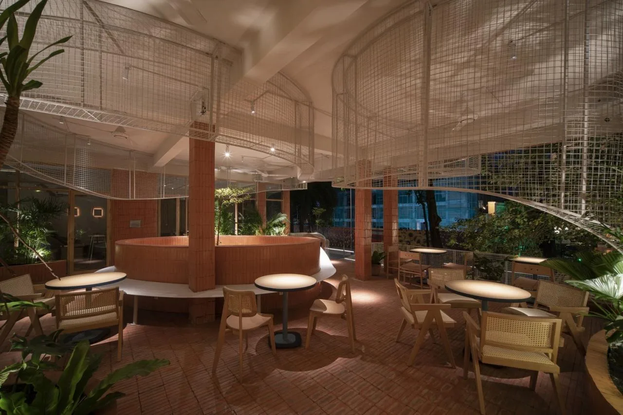 BIM Architecture | Collision of Curved Metal Grid and Red Clay Bricks: Brother Coffee Baking Shop/Red5 Studio