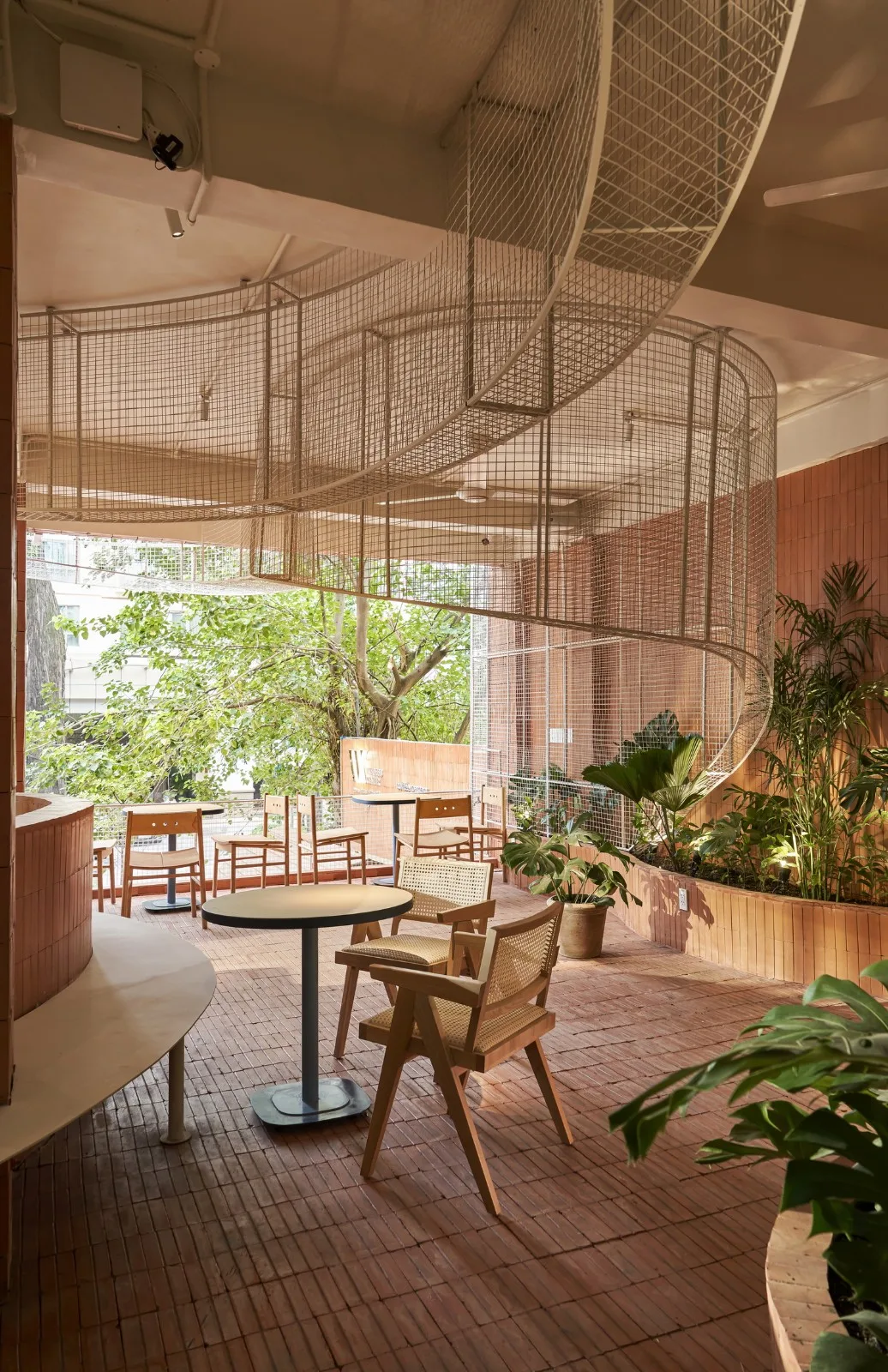 BIM Architecture | Collision of Curved Metal Grid and Red Clay Bricks: Brother Coffee Baking Shop/Red5 Studio
