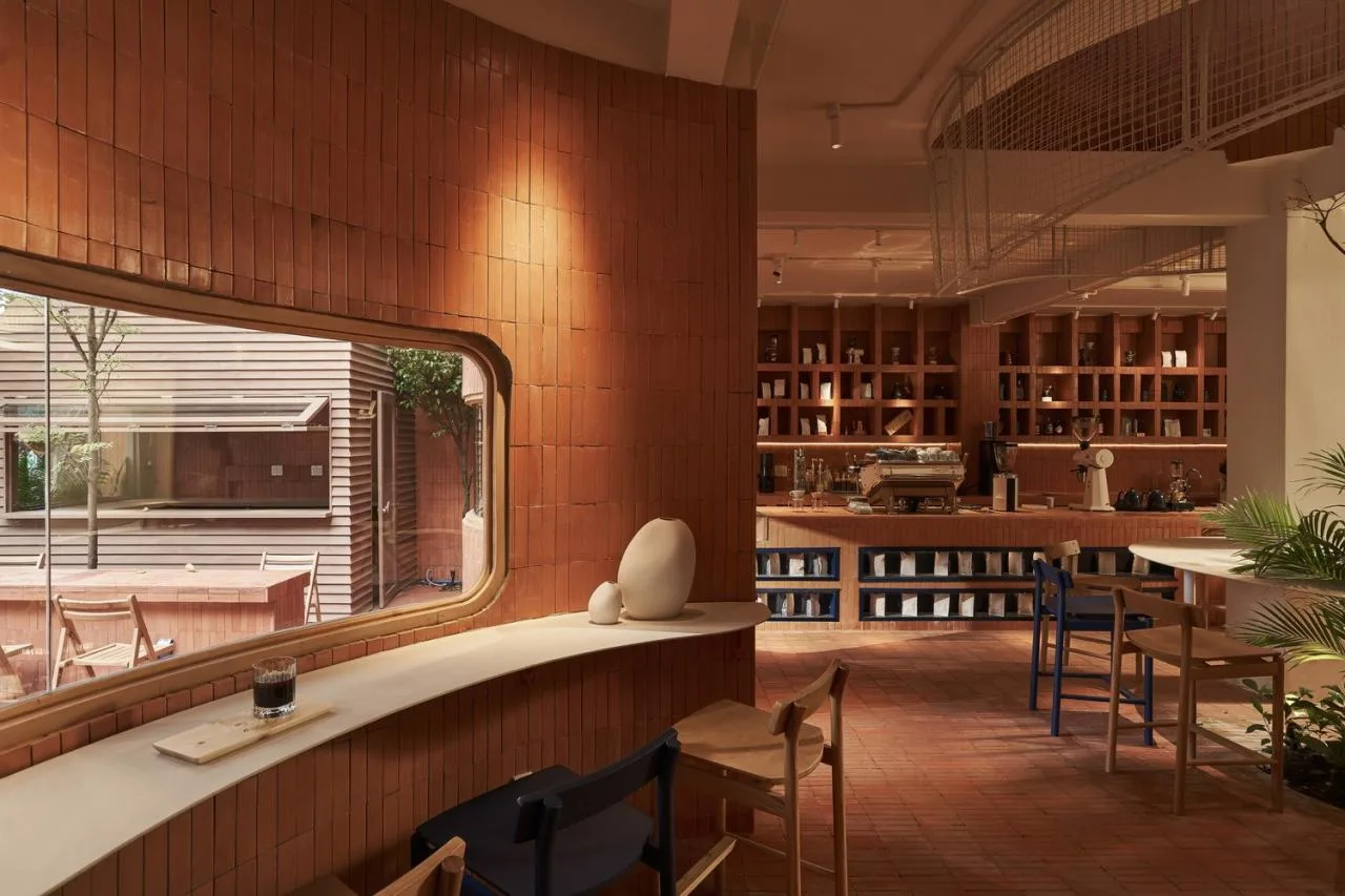BIM Architecture | Collision of Curved Metal Grid and Red Clay Bricks: Brother Coffee Baking Shop/Red5 Studio