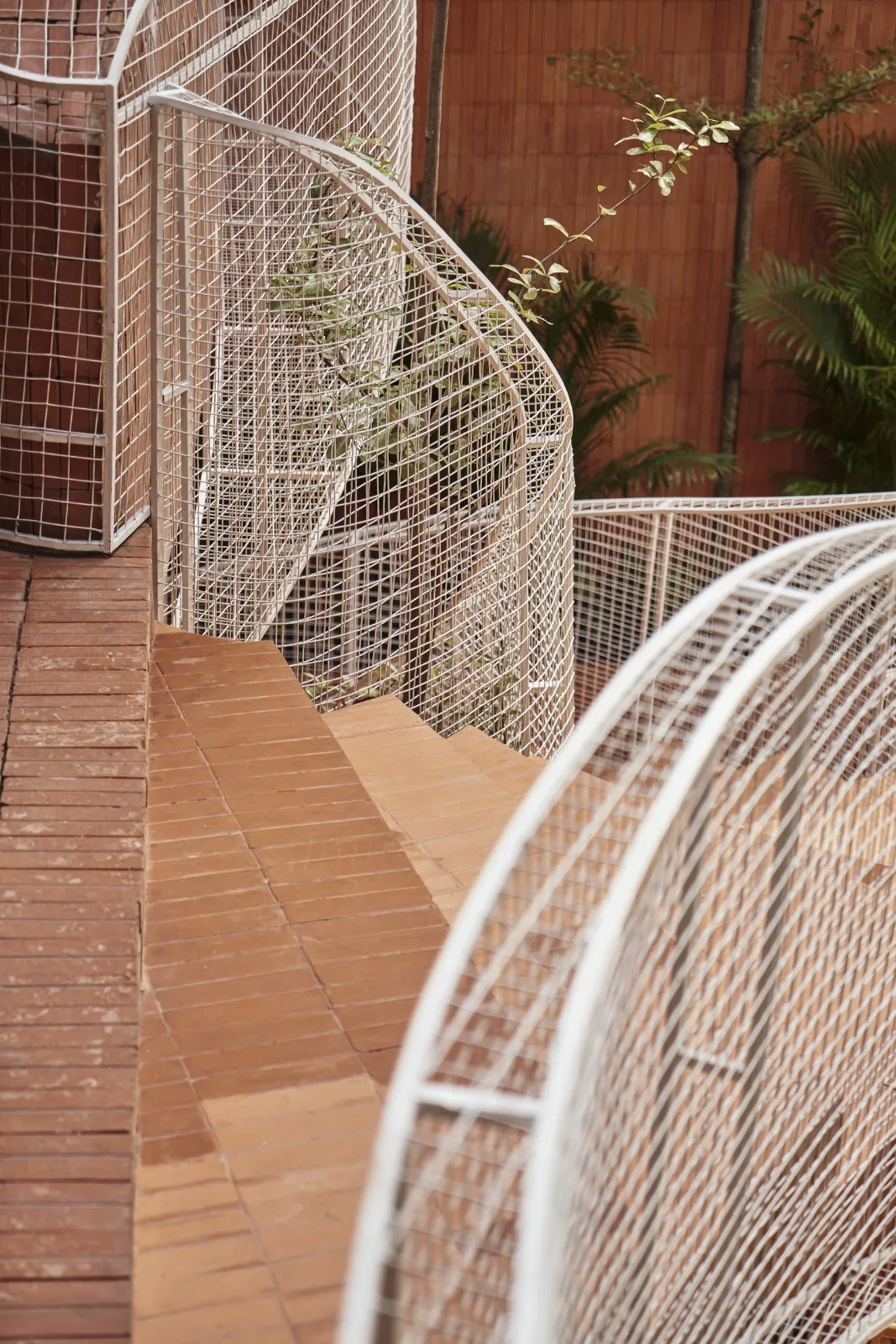 BIM Architecture | Collision of Curved Metal Grid and Red Clay Bricks: Brother Coffee Baking Shop/Red5 Studio