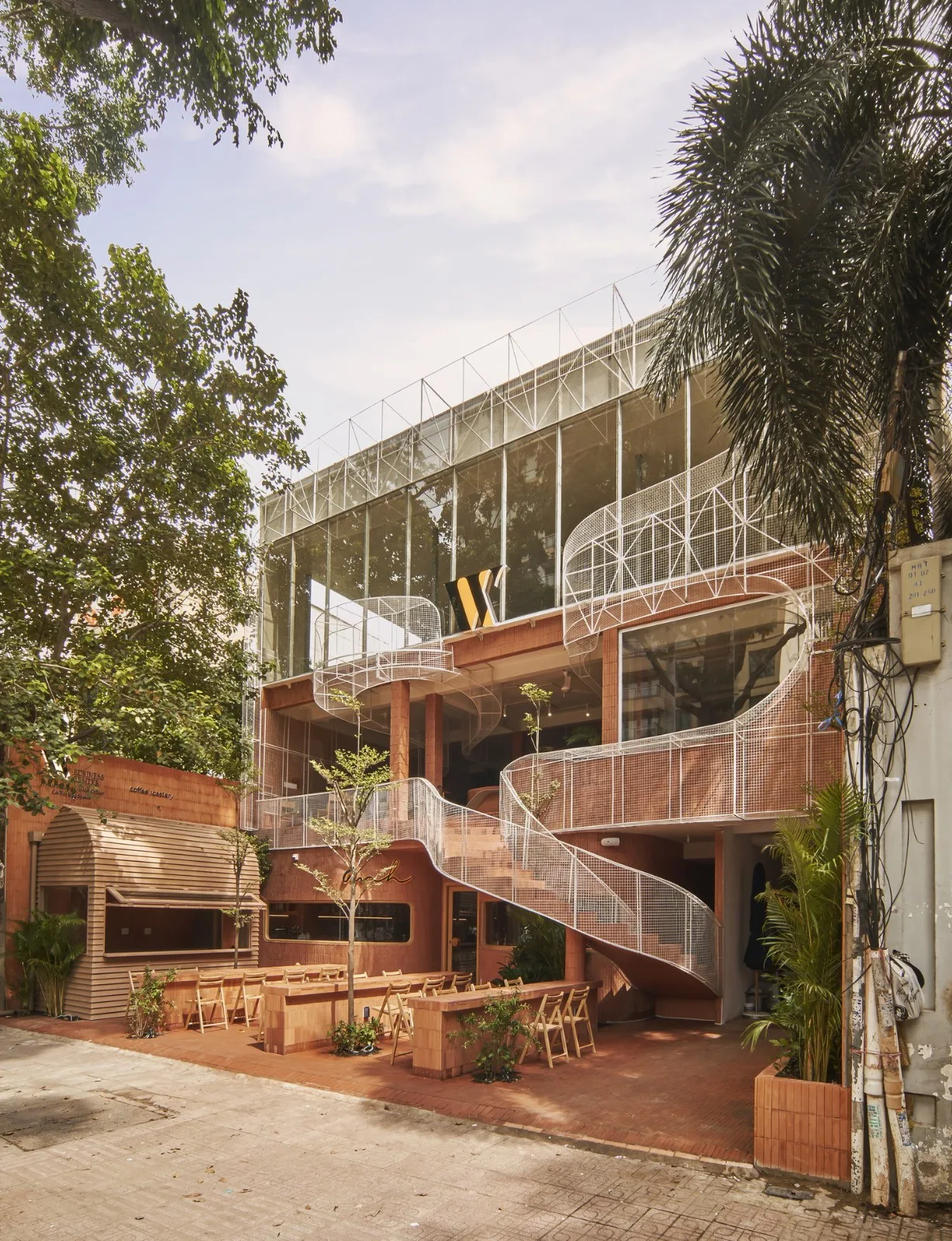 BIM Architecture | Collision of Curved Metal Grid and Red Clay Bricks: Brother Coffee Baking Shop/Red5 Studio