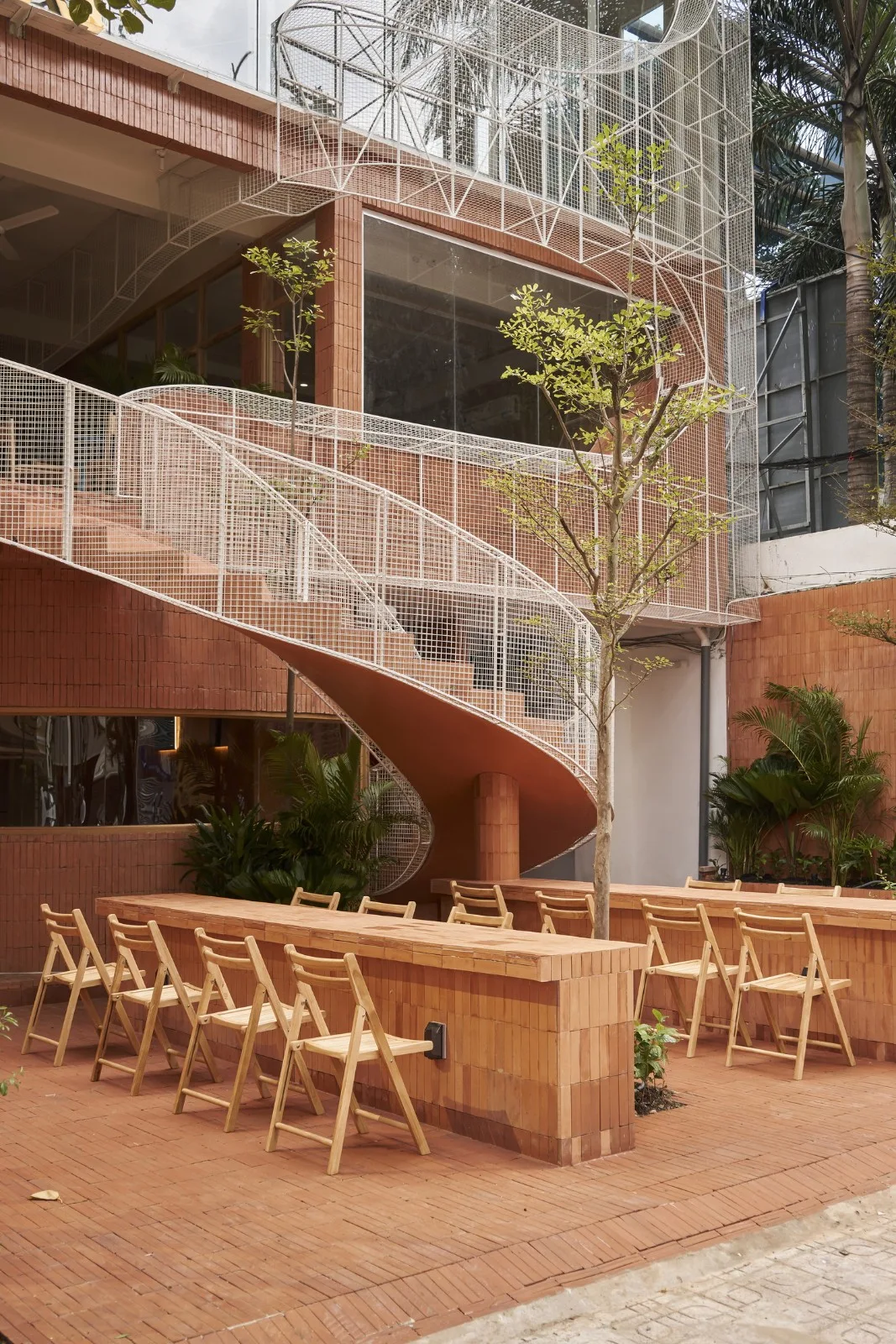 BIM Architecture | Collision of Curved Metal Grid and Red Clay Bricks: Brother Coffee Baking Shop/Red5 Studio
