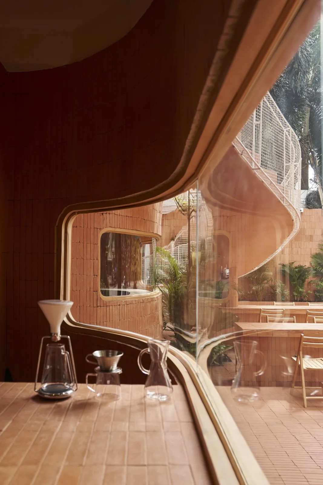 BIM Architecture | Collision of Curved Metal Grid and Red Clay Bricks: Brother Coffee Baking Shop/Red5 Studio