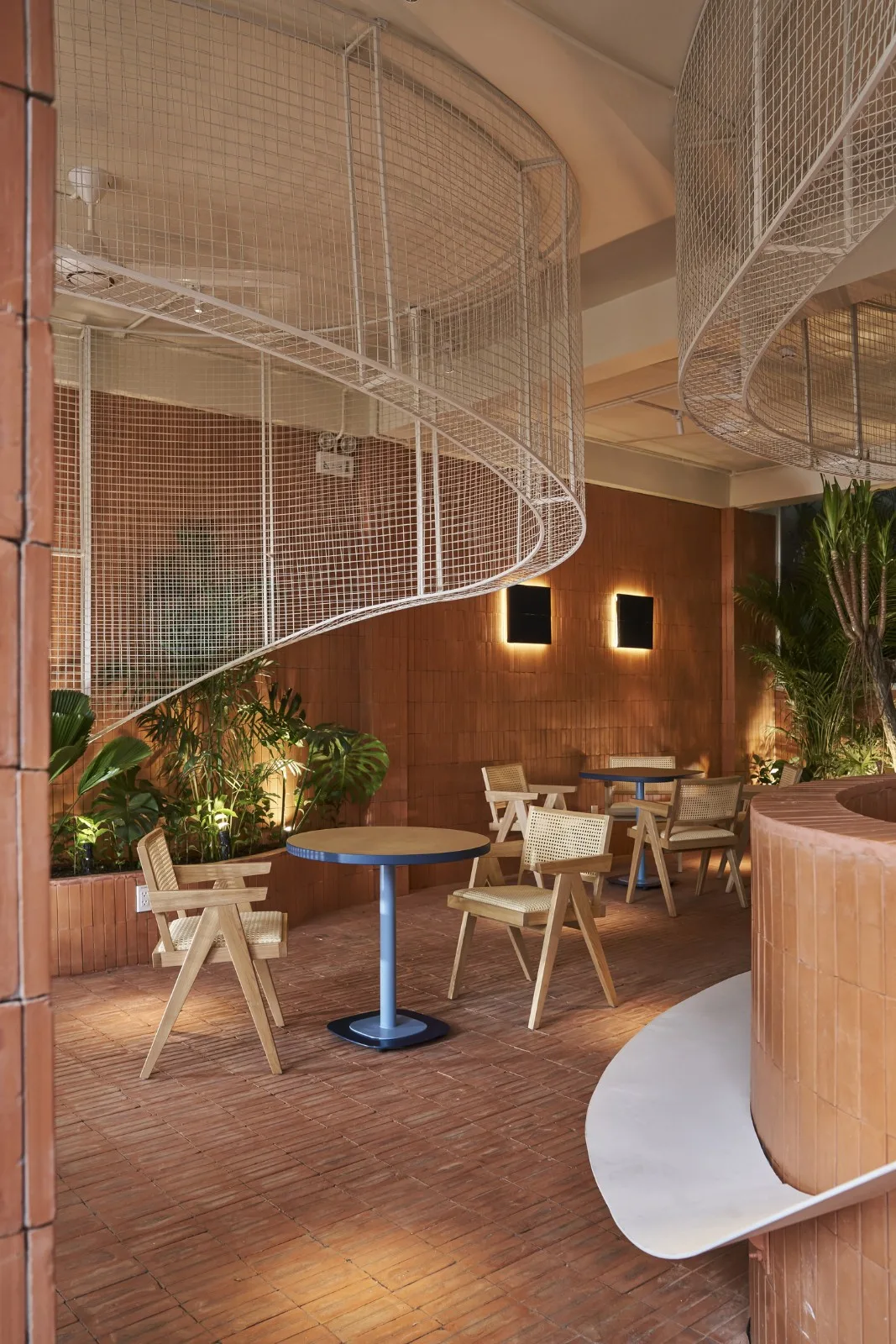 BIM Architecture | Collision of Curved Metal Grid and Red Clay Bricks: Brother Coffee Baking Shop/Red5 Studio