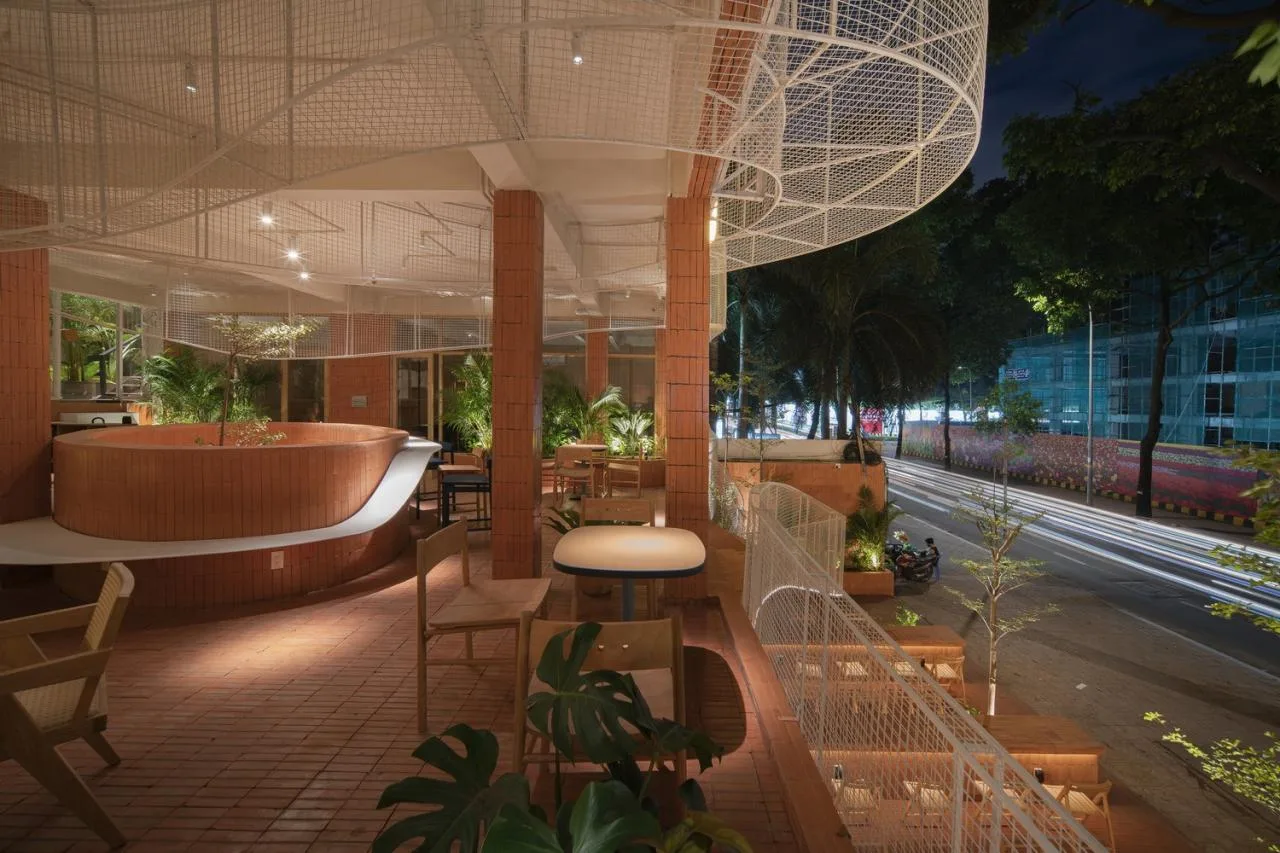 BIM Architecture | Collision of Curved Metal Grid and Red Clay Bricks: Brother Coffee Baking Shop/Red5 Studio