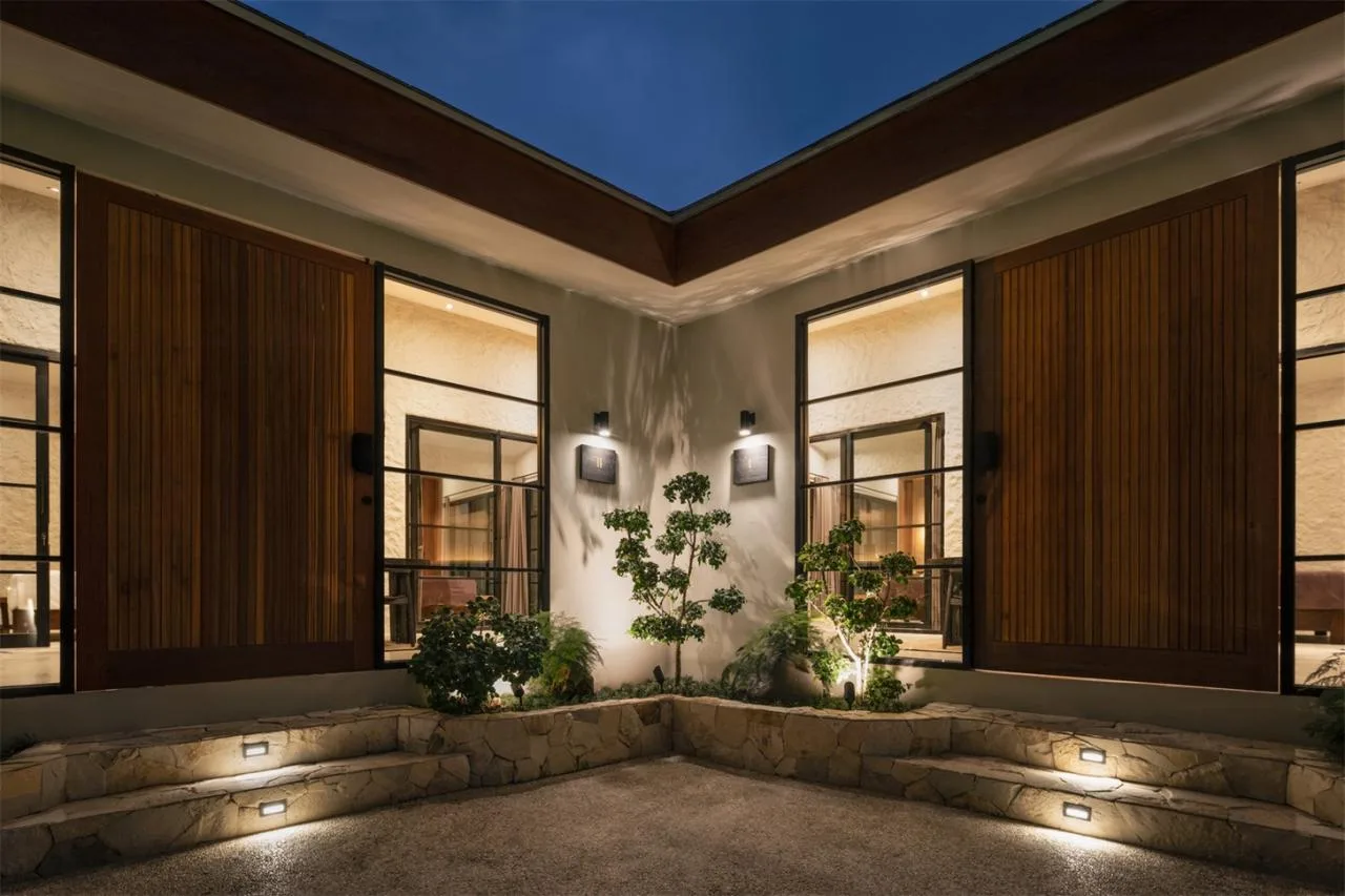 The Wabi Sabi Realm in the Poetic Forest: Design of a Natural Villa Under a Flipped Roof