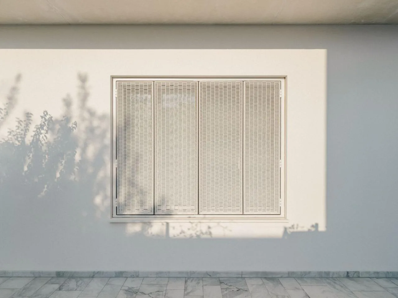Sculpture like exposed concrete runs through the entire narrow rectangular flat design