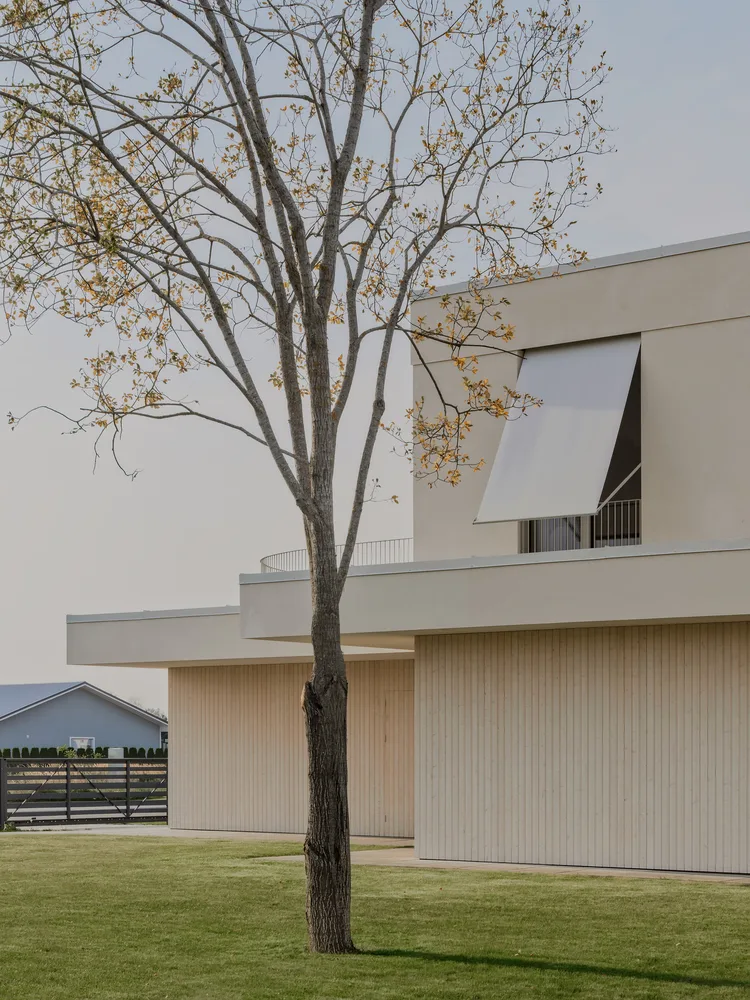 A minimalist villa design with warm, natural, smooth details, simple linear symmetry rhythm