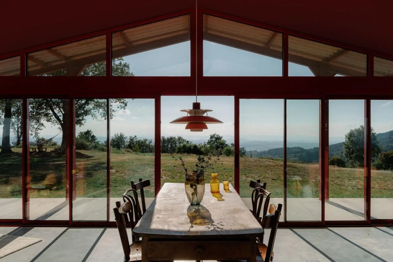 A serene vacation home design with red gemstones hidden in a lush and magnificent environment