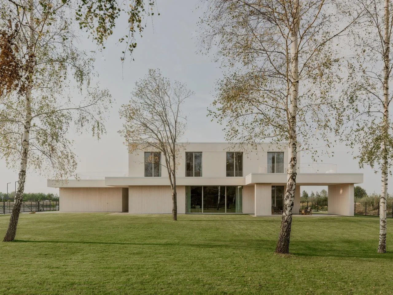 A minimalist villa design with warm, natural, smooth details, simple linear symmetry rhythm
