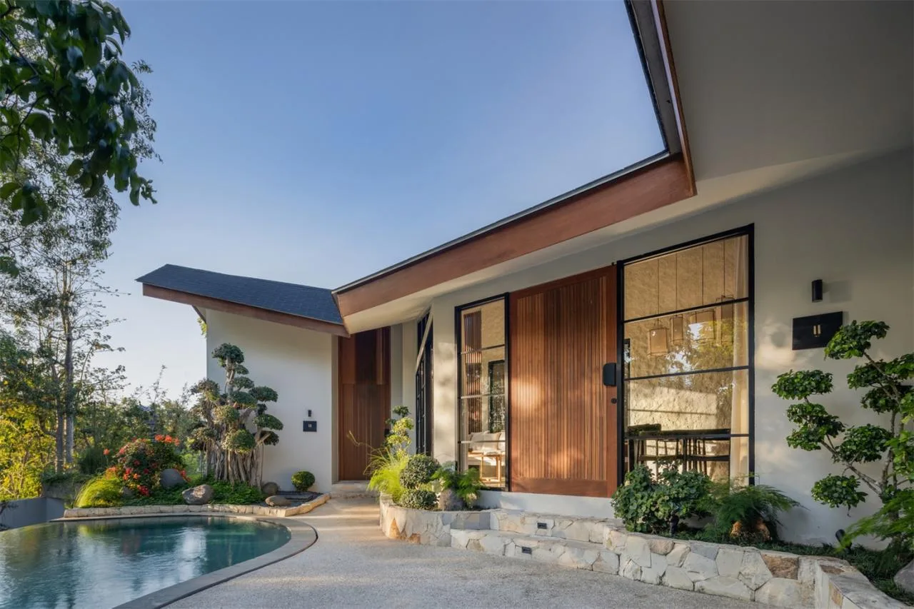 The Wabi Sabi Realm in the Poetic Forest: Design of a Natural Villa Under a Flipped Roof