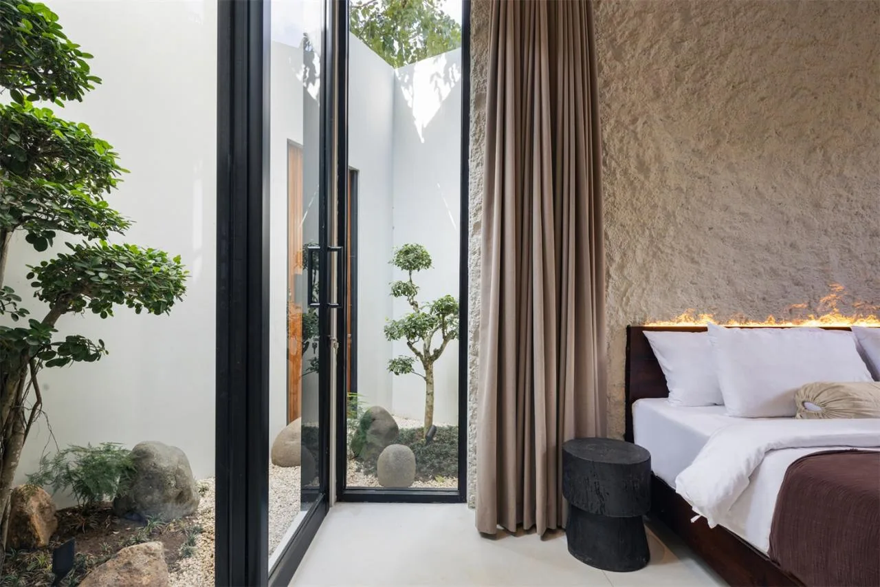 The Wabi Sabi Realm in the Poetic Forest: Design of a Natural Villa Under a Flipped Roof