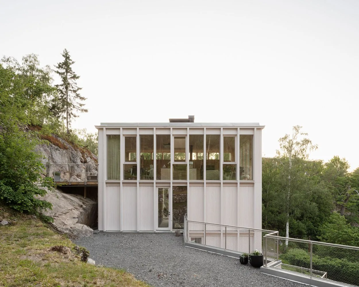 Miracle of architecture by the strait, challenging the terrain to create a stunning view of wooden villa design