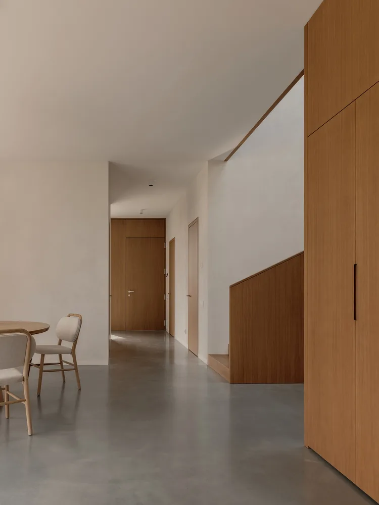 A minimalist villa design with warm, natural, smooth details, simple linear symmetry rhythm