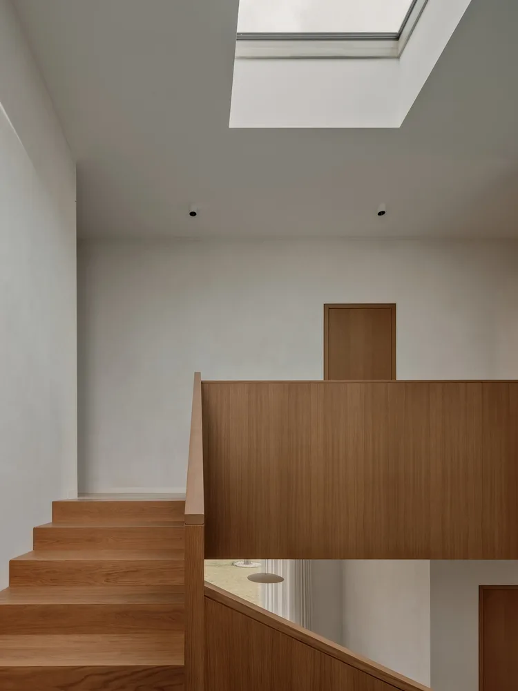 A minimalist villa design with warm, natural, smooth details, simple linear symmetry rhythm