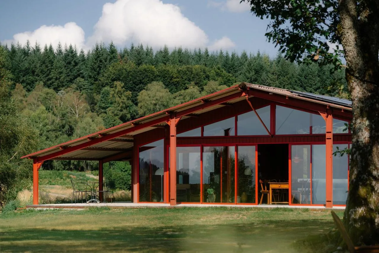A serene vacation home design with red gemstones hidden in a lush and magnificent environment