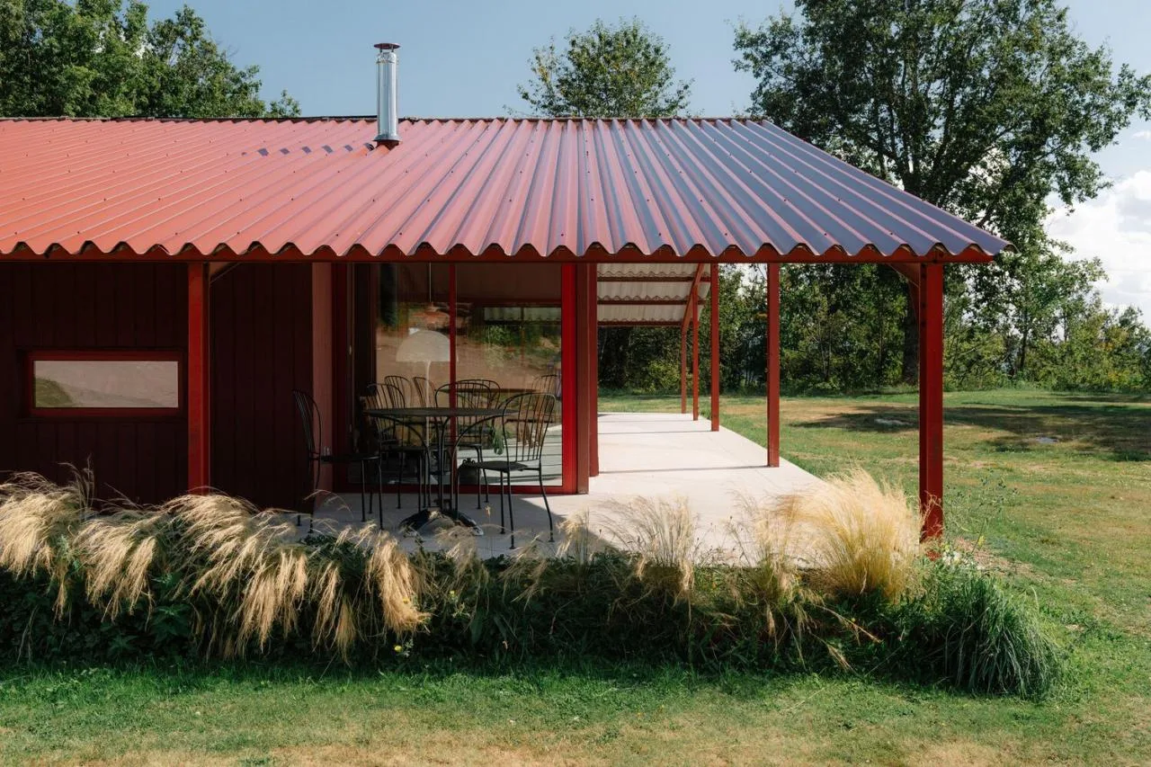 A serene vacation home design with red gemstones hidden in a lush and magnificent environment
