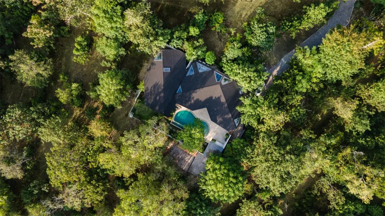 The Wabi Sabi Realm in the Poetic Forest: Design of a Natural Villa Under a Flipped Roof