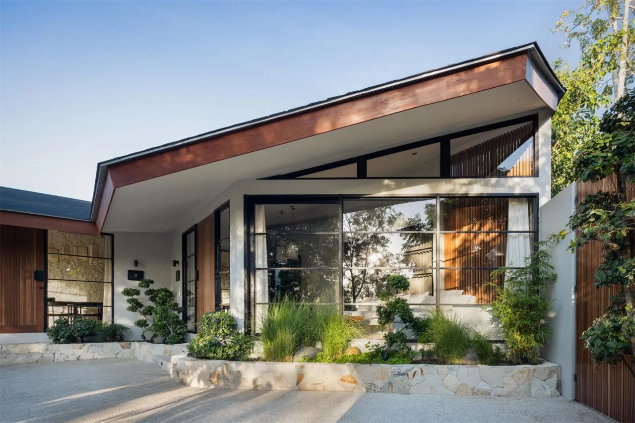The Wabi Sabi Realm in the Poetic Forest: Design of a Natural Villa Under a Flipped Roof