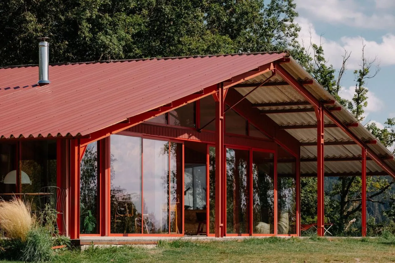 A serene vacation home design with red gemstones hidden in a lush and magnificent environment